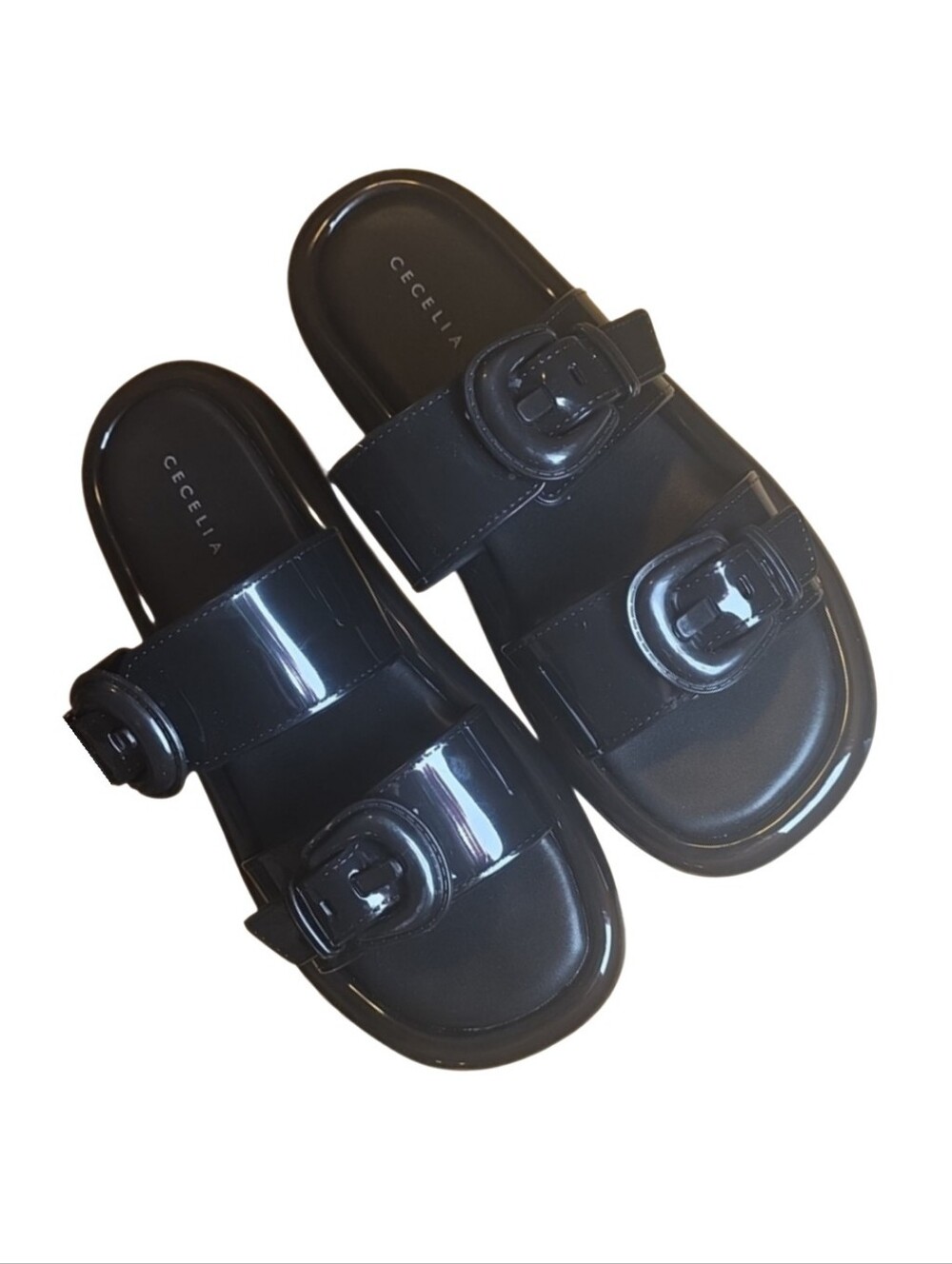 Cecelia New York "Jump" jelly slide sandals in a sleek, glossy black finish. 8